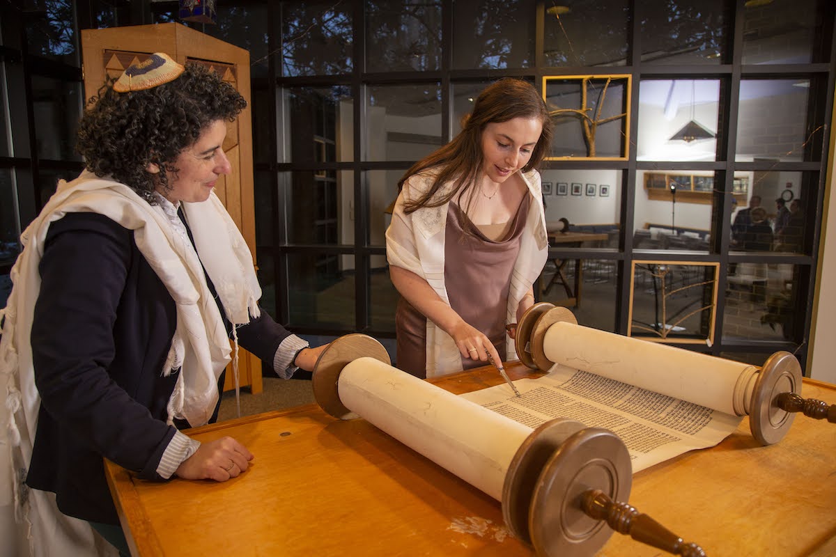 Student reading Torah