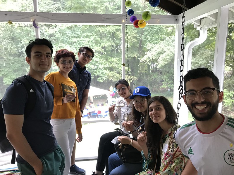 a group of students smile at the center for muslim life barbecue