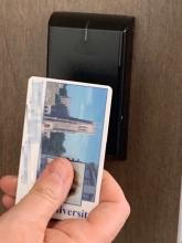 holding a dukecard up to a reader