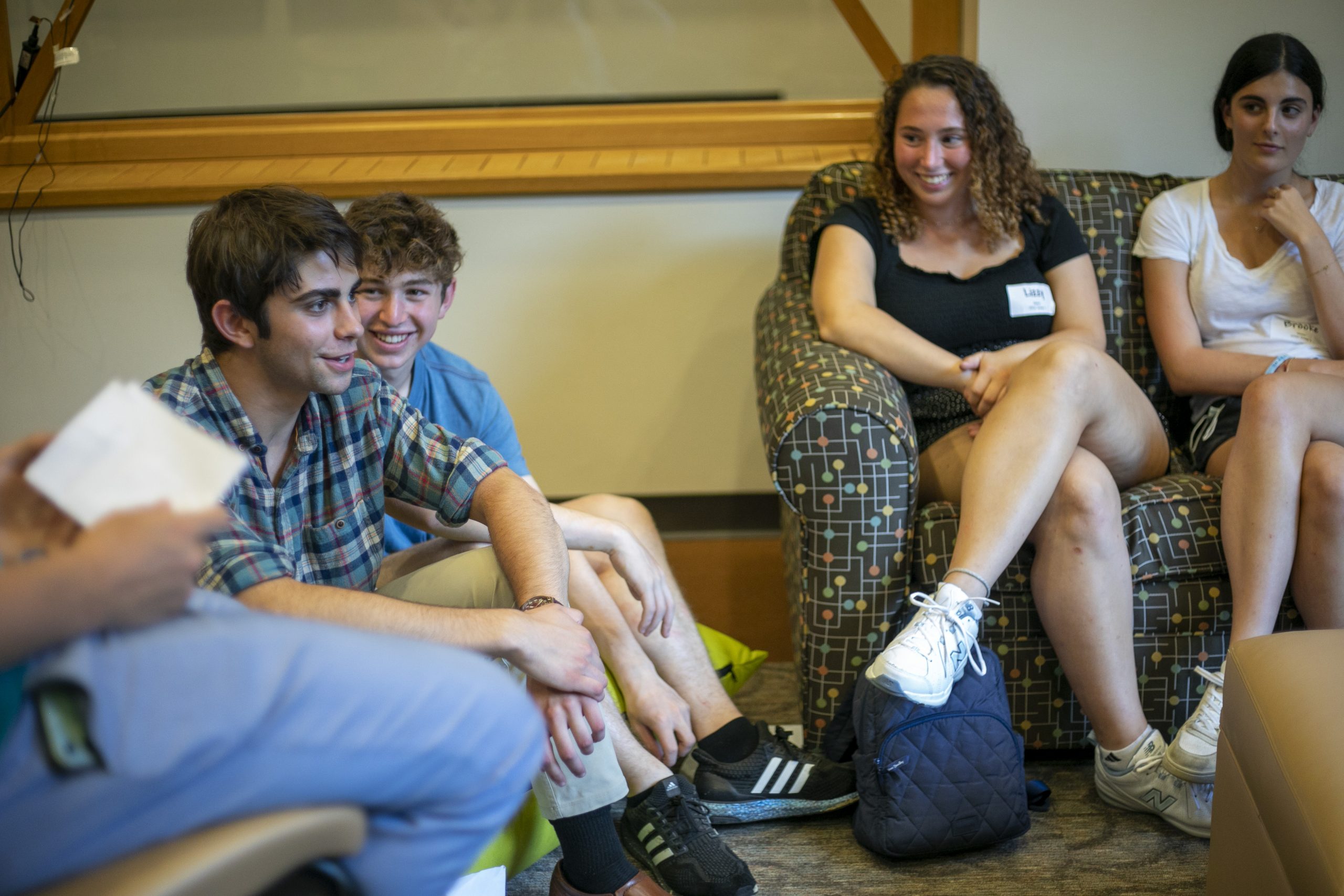Students have a conversation at the student center