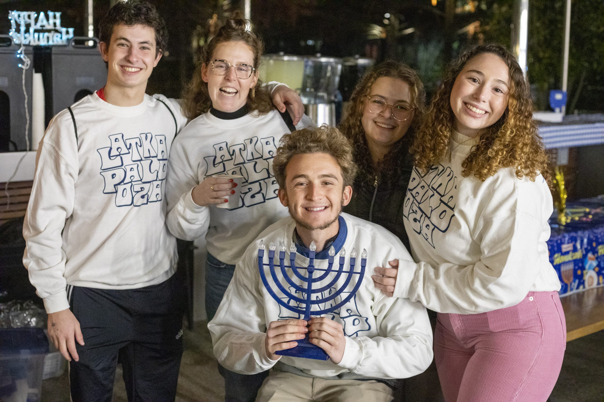 Students smile at a Hanukkah party