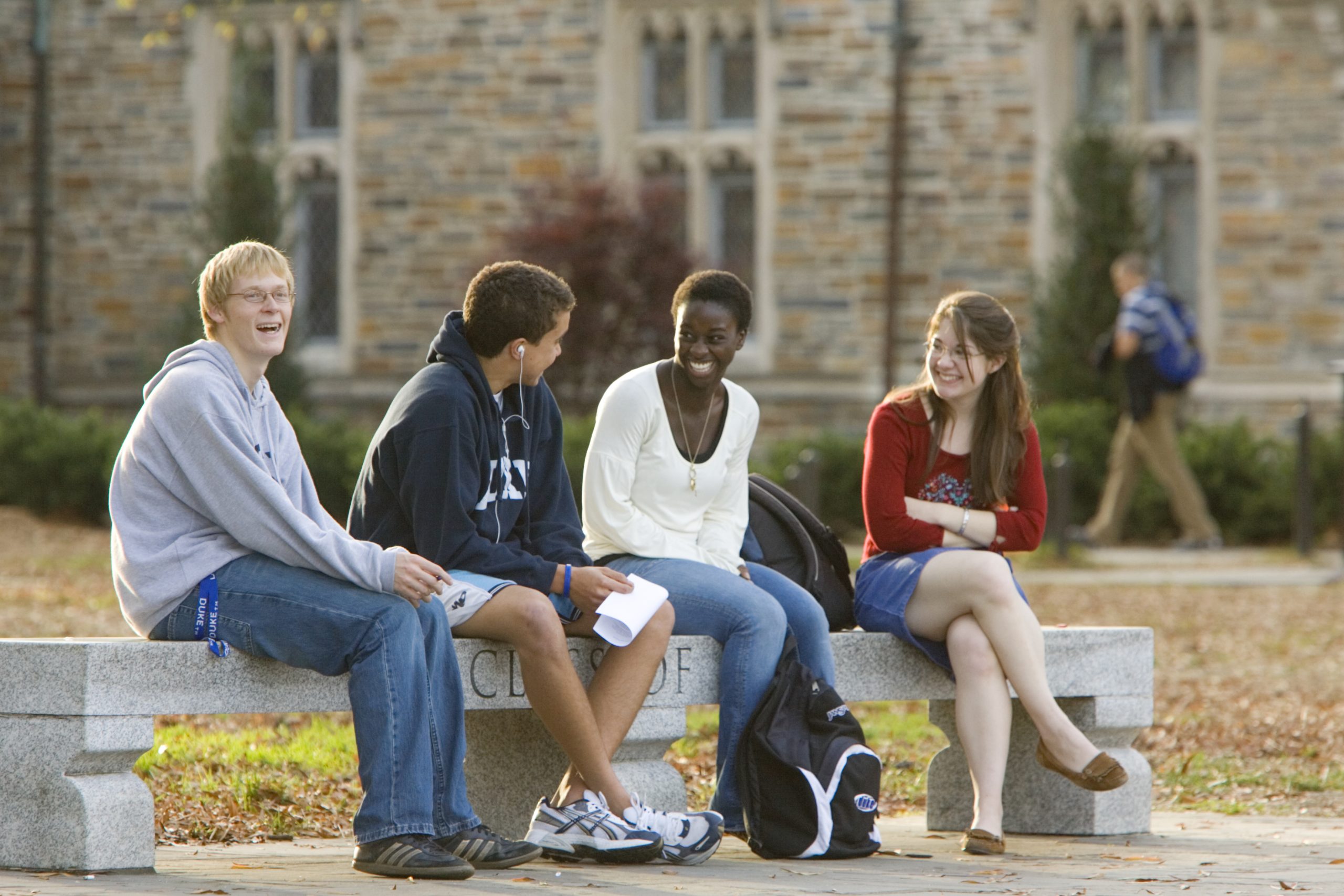 Students on West Campus bench