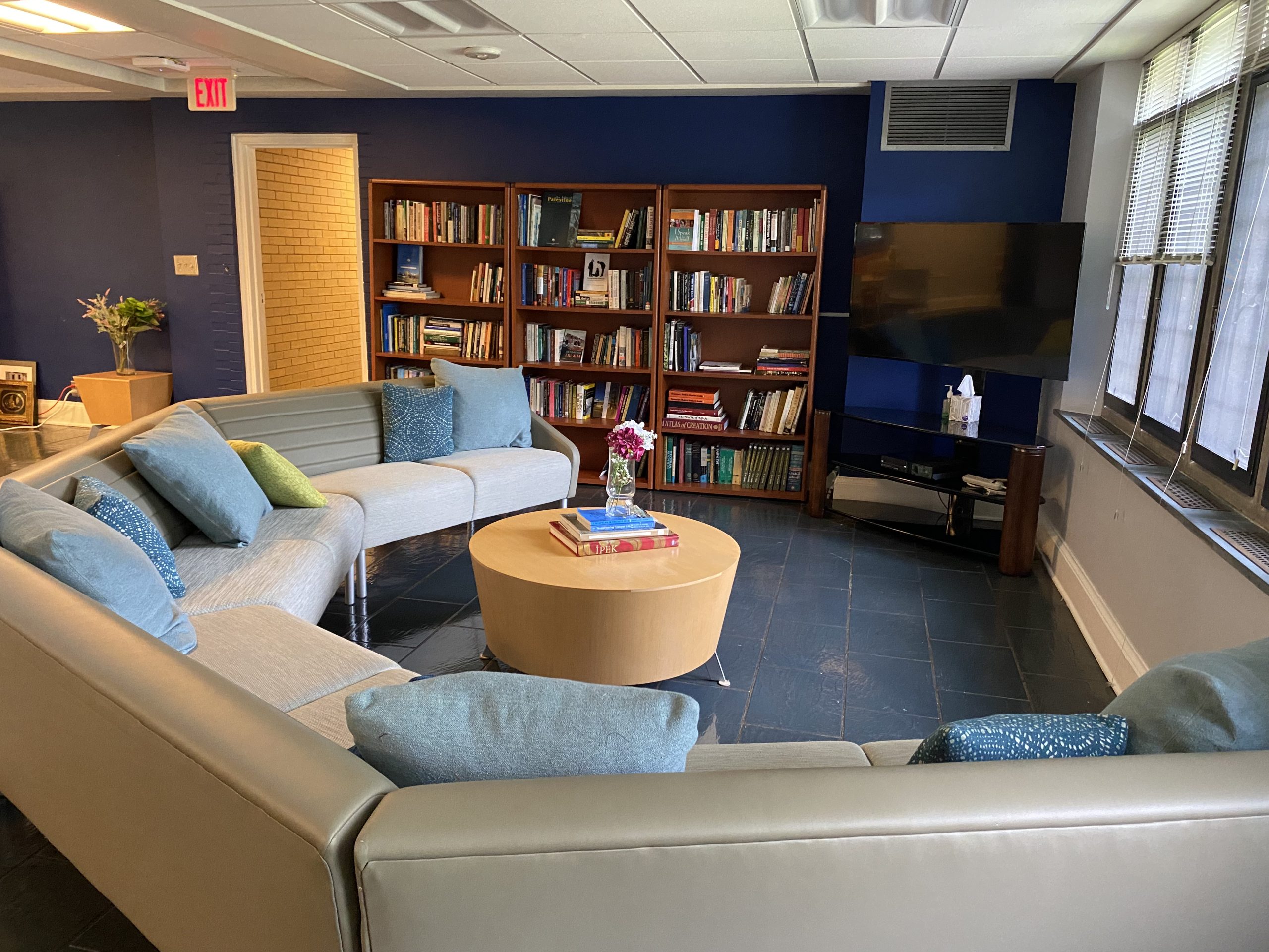 CML lounge with a tv and bookcases
