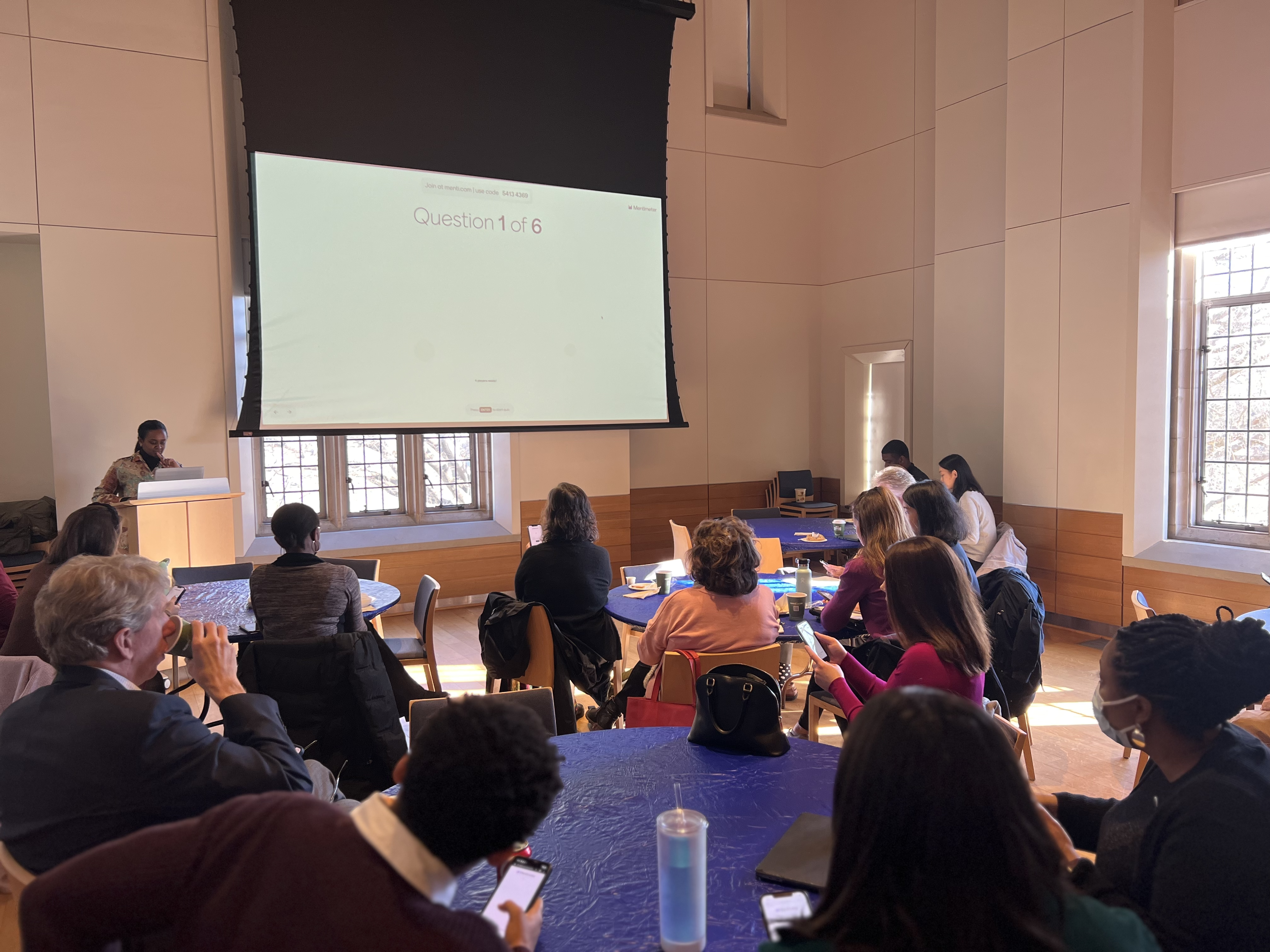 CML Program Coordinator, Hadeel Hamoud, leading an icebreaker game on a projector to group of faculty and staff